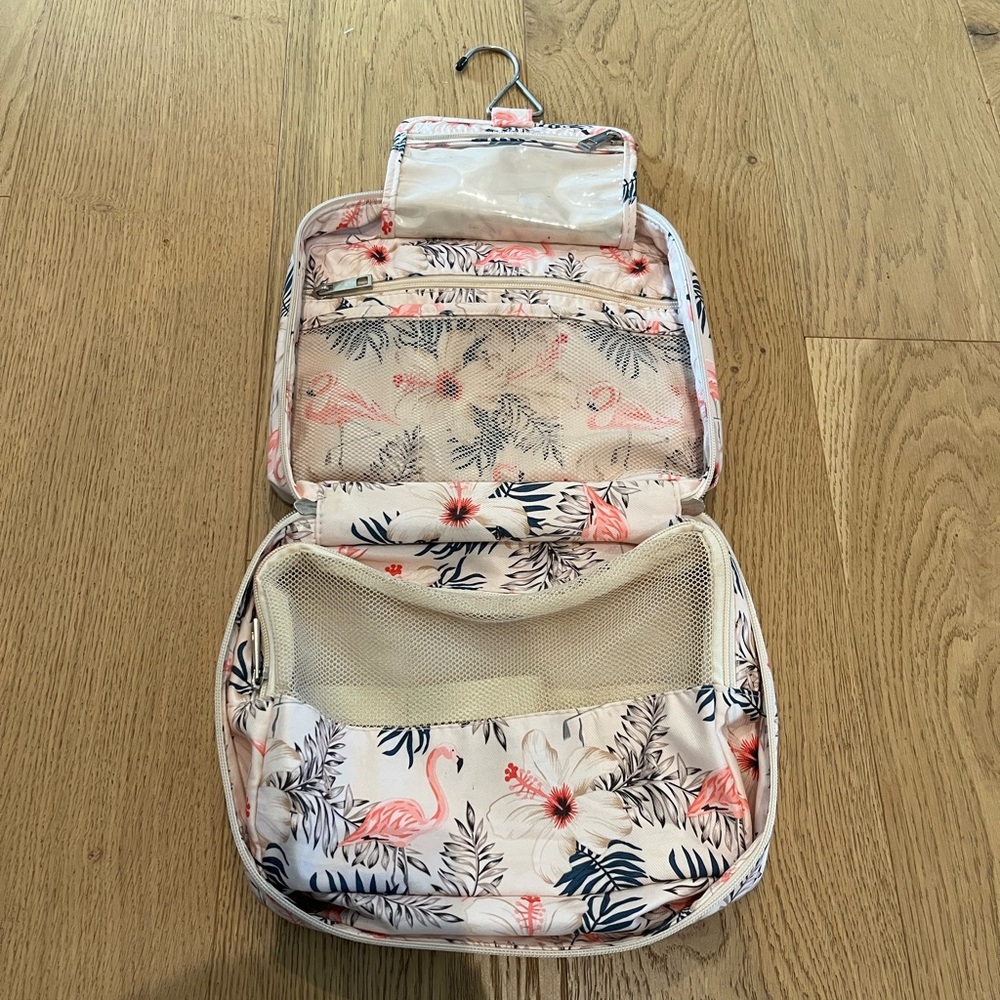 Women’s cosmetic travel bag with multiple pockets for makeup and toiletries!